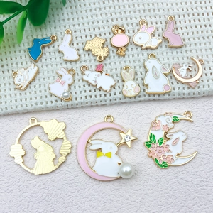 Detailed macro view of assorted enamel bunny rabbit alloy charms for DIY jewelry making