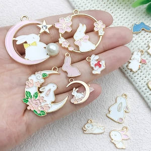 Cartoon enamel rabbit pendants with moon and sakura motifs for DIY jewelry making