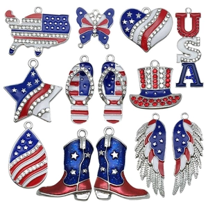 Detailed macro view of Independence Day USA flag enamel charms with sparkling rhinestones
