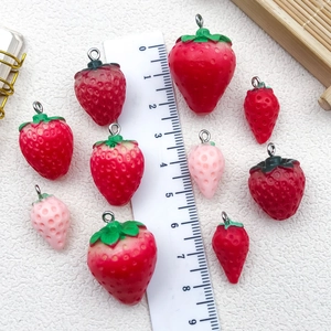 3D resin strawberry charms in various sizes and colors for DIY jewelry and crafts