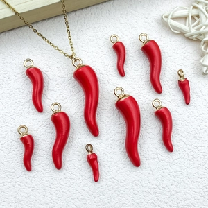 Set of various sized red chili pepper charms with gold base for DIY jewelry making