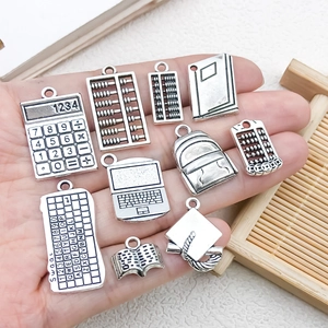 Assorted DIY alloy pendants in stationery and academic shapes with vintage silver finish