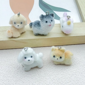 Detailed view of flocked resin puppy charms with metal rings for DIY keychains