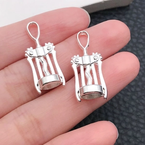 Macro shot of silver winged corkscrew charms for DIY bracelets and necklaces set
