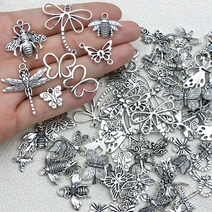 Vintage silver alloy insect charms featuring butterfly and bee shapes for DIY jewelry making