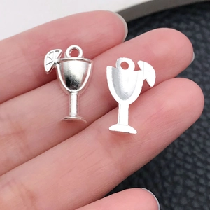 Detail of silver cocktail glass charm with lemon slice for DIY jewelry making