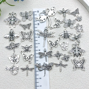 Vintage silver alloy insect charms including butterflies, bees, and dragonflies for DIY crafts