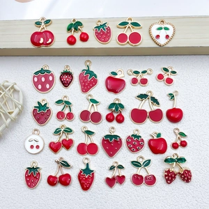 Assorted red enamel cherry and strawberry fruit charms with gold metal edges for DIY jewelry