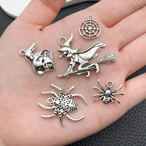 Five assorted Halloween alloy charms including spiders and witches in antique silver finish