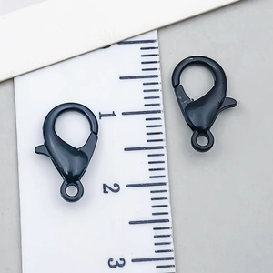Matte black alloy lobster clasps for DIY jewelry making shown with size ruler