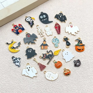 Macro shot of Halloween charms including ghosts, pumpkins and bats for DIY jewelry making