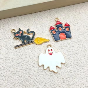 Close-up of Halloween enamel charms featuring a black cat, a castle, and a cute ghost