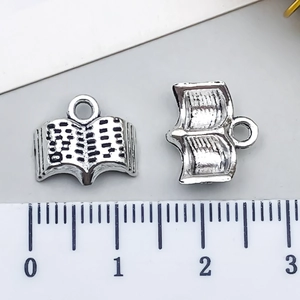 Vintage silver alloy open book charm with loop for DIY jewelry and necklaces