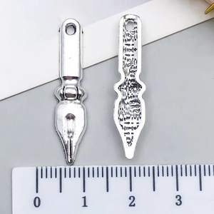 DIY silver fountain pen nib alloy pendant for keychains and necklaces shown with ruler