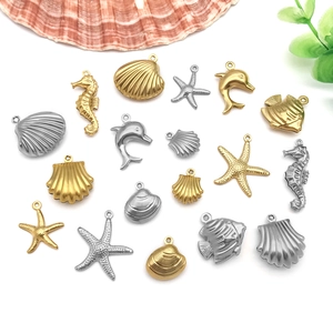 Polished gold and silver stainless steel ocean themed charms including starfish and seahorse