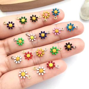 Miniature daisy enamel charms in assorted colors for DIY jewelry making and crafts