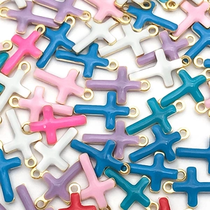 Detailed close-up of colorful enamel cross charms with gold plating for DIY jewelry making