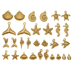 Gouden roestvrijstalen oceaan bedelset met schelp, zeester en zeepaardje voor DIY sieraden