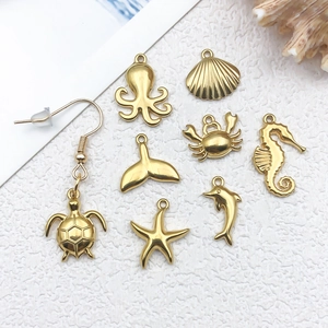 Golden stainless steel ocean pendants set including seashell and sea horse for DIY jewelry