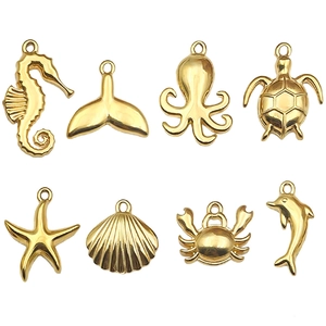 Polished gold ocean charms including seahorse, turtle and starfish for jewelry making