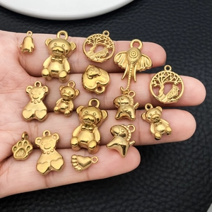 Polished gold stainless steel animal pendants including bear and elephant charms