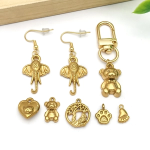 Gold-plated stainless steel jewelry set featuring bear elephant pendants and ear hooks