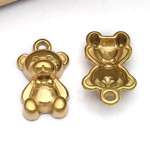 Polished gold bear charms for DIY jewelry making with smooth metallic finish and back cutout
