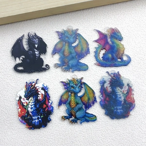 Macro shot of six assorted acrylic dragon charms for DIY jewelry making and crafts
