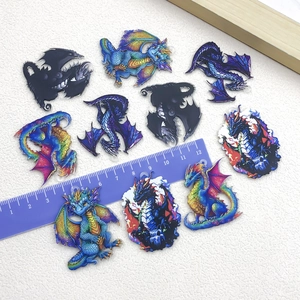 Set of 10 acrylic double-sided dragon pendants with ruler for size reference