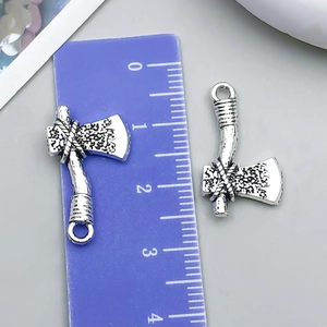 Detail view of retro silver axe charms with ruler showing length of 2.6cm to 2.8cm