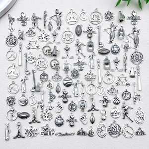 Close-up of antique silver alloy sports charms for DIY jewelry making and crafts