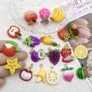 Detail view of assorted resin 3D fruit pendants for DIY jewelry making and crafts