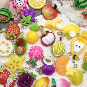 Detail showing colorful resin fruit charms with secure metal rings for DIY jewelry making