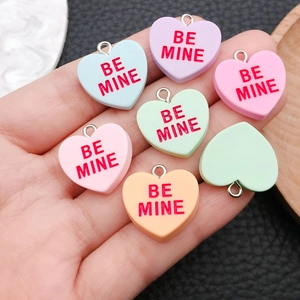 Colorful resin heart pendants set in macaron tones with metal rings for DIY jewelry