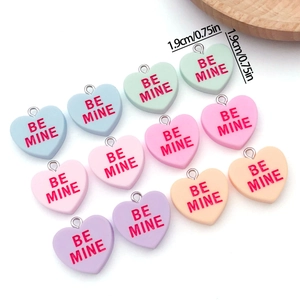 Colorful resin heart pendants with Be Mine text and metal rings for DIY jewelry