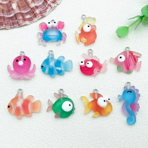 Detail of colorful resin marine animal pendants with rings for DIY jewelry and keychain