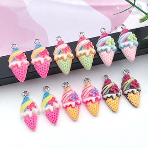 Detailed view of 12 resin ice cream pendants with metal eyelets and colorful bows