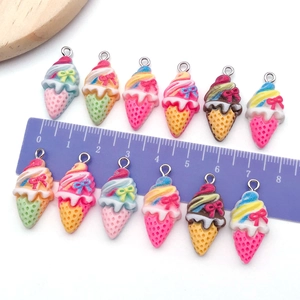 Detailed close-up of resin ice cream charms with metal hooks showing 3cm length on a scale