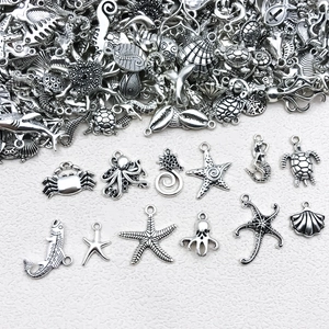 Detailed collection of antique silver ocean charms including seahorses, turtles and starfish