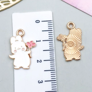 White enamel rabbit pendant with pink flower and golden alloy ring for DIY jewelry