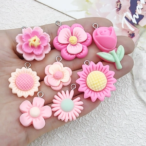 Assorted resin flower charms including roses and daisies for DIY jewelry and crafts