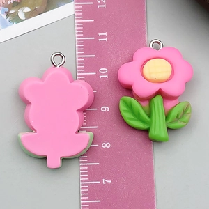 Detail view of pink resin flower pendant size measurement with silver metal ring