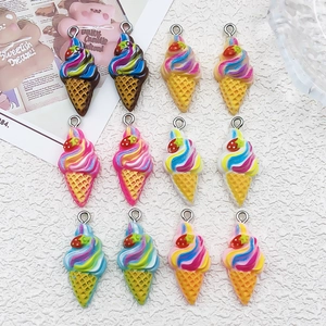 Close-up of resin ice cream cone DIY charms with strawberry detail and metal hooks