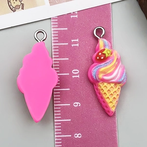 Detail view of 2.5cm resin ice cream cone pendants with pink cream and silver rings