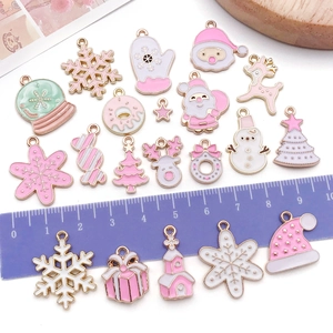 Pink and white enamel Christmas charms set with Santa, snowflakes, and tree for DIY jewelry