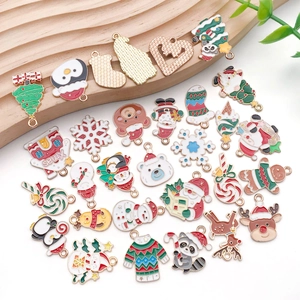 Detailed set of Christmas enamel charms including Santa, elk, and trees for DIY jewelry