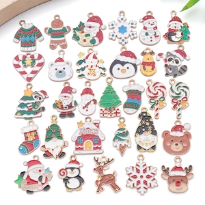 Detail view of assorted Christmas alloy enamel charms for DIY jewelry making sets
