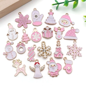 Macro shot of 20 pink and white Christmas enamel charms for DIY jewelry making