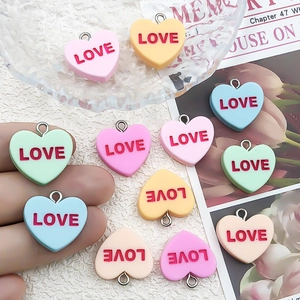 Colorful heart-shaped resin pendants with LOVE lettering and metal rings for DIY jewelry