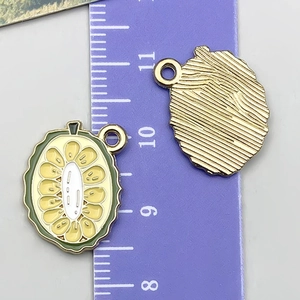 Detailed view of yellow fruit pendant with size scale for handmade jewelry DIY projects